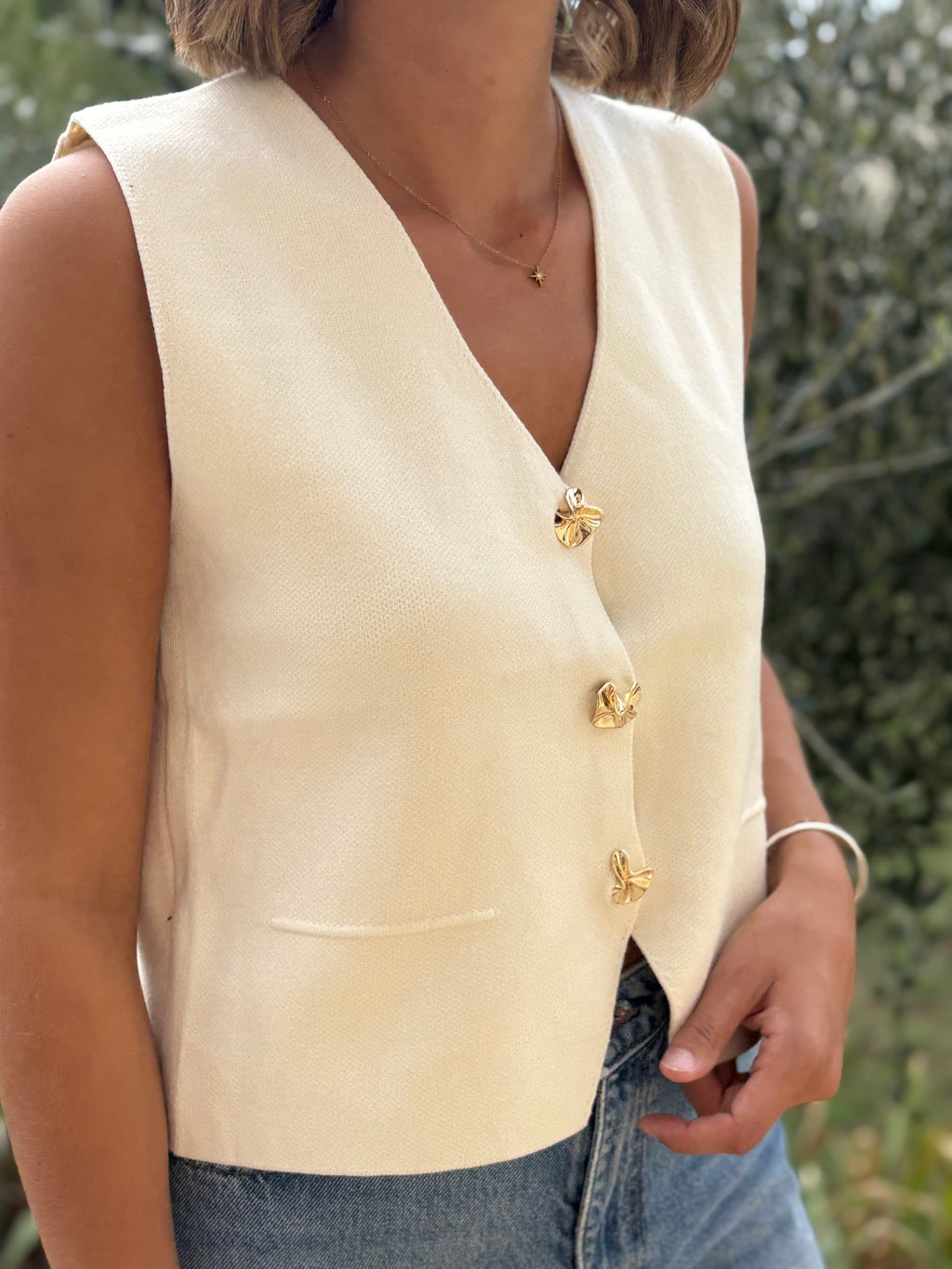 Gilet sans manches à boutons