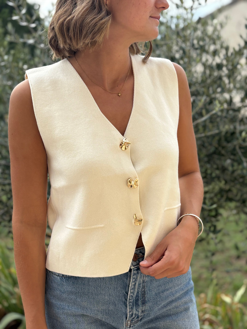 Gilet sans manches à boutons